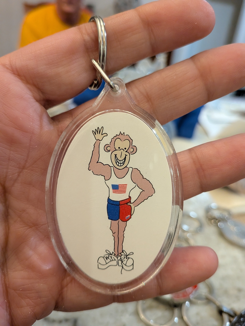 Clear Oval Keychain with Patriotic Monkey Design - White/Red/Blue